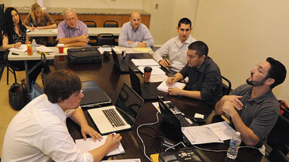 A training meeting for new associates is held by Chris Williams (far right)at American Income Life Arias Agencies.