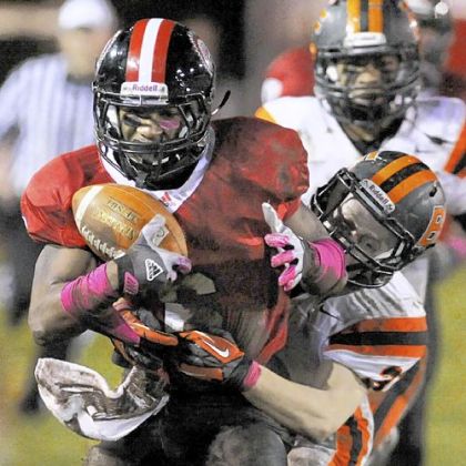 Aliquippa's Dravon Henry picks up a first down against Beaver Falls last week.