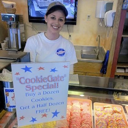 Bethel Bakery sales and marketing assistant Julie Lytle displays the store's CookieGate" special.