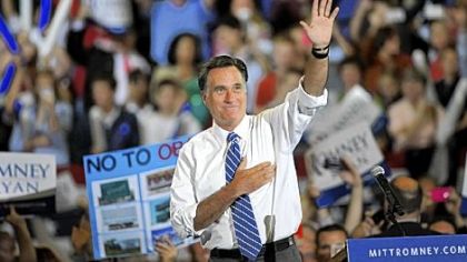 Republican presidential candidate, former Massachusetts Gov. Mitt Romney waves to supporters during a campaign rally on in Asheville, North Carolina.