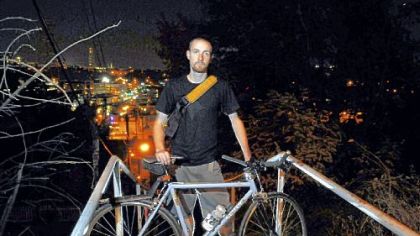 Colin Albright stands with his bicycle at the top of the steps at Josephine Street in the South Side Slopes, where he was attacked and slashed on Sept. 5.