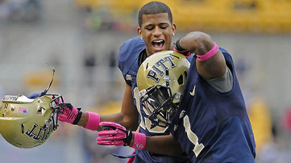Pitt's Ray Graham is congratulated by Devin Street after scoring a touchdown against Temple in the second quarter at Heinz Field this afternoon.