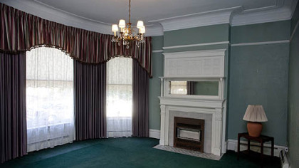 The front sitting room features a fireplace.