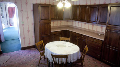 The kitchen is a combination of two connecting rooms, one for cooking and the other for eating.