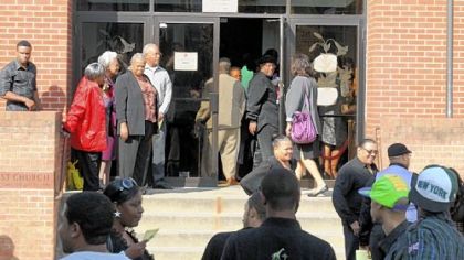 Friends and family of Charlene Walters leave after a memorial service Friday in Mount Ararat Baptist Church in Larimer. She was killed at her grandson's youth football game.