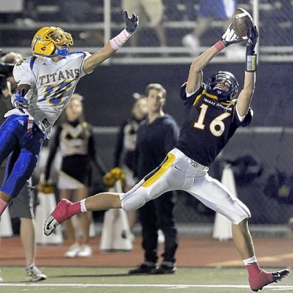 Thomas Jefferson's Colton Booher pulls in a touchdown pass Friday against West Mifflin's Jarod Wright.