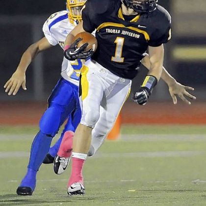 Thomas Jefferson's Zach Schademan returns a punt for a touchdown Friday against West Mifflin.