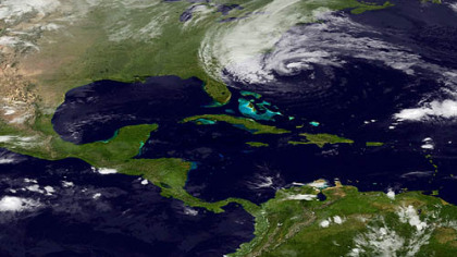 In this image taken Sunday by NOAA's GOES East,  Hurricane Sandy is seen on the East Coast of the United States. Sandy weakened briefly to a tropical storm Saturday but was soon back up to Category 1 strength.