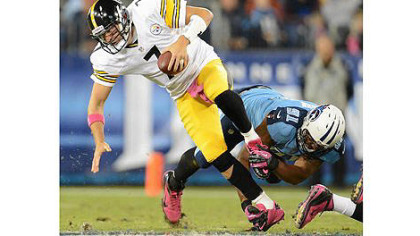The Titans Derrick Morgan sacks Steelers quarterback Ben Roethlisberger.