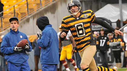 Steelers kicker Shaun Suisham, decked out in the retro Steelers uniform, practices kicks before the start of the Steelers-Redskins game at Heinz Field.