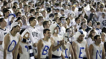 Penn State students, with their bodies painted to read "O'Brien," react after Ohio State scores a touchdown in the second half.