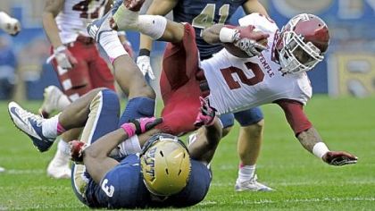 Pitt's Nicholas Grigsby upends Temple's Matt Brown in the first quarter Saturday at Heinz Field.