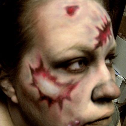 Step Seven: To add wounds, simply get out your red lipstick or lipliner, drawing loose erratic wounds.