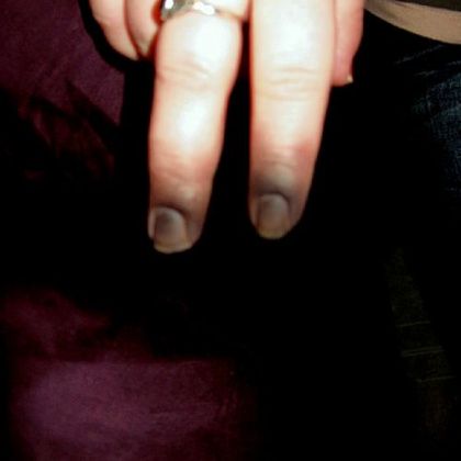 Makeup applied to finger tips as part of zombie DIY look.