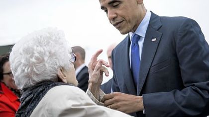 President Barack Obama speaks with a supporter Wednesday after arriving at Eastern Iowa Airport in Mt. Vernon, Iowa. Mr. Obama traveled to Iowa and Ohio to attend campaign rallies in the two swing states.