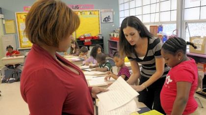 Pittsburgh Sunnyside PreK-8 teachers Carla Jackson, left, and Amy James, co-teach a third-grade writing class at the  Stanton Heights school.