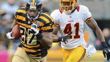 Running back Jonathan Dwyer picks up 10 yards against the Redskins in the third quarter Sunday at Heinz Field. Dwyer ran for a game-high 107 yards.