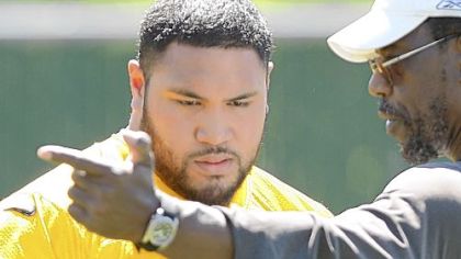 Steelers defensive lineman Alameda Ta'amu, left, with defensive line coach John Mitchell