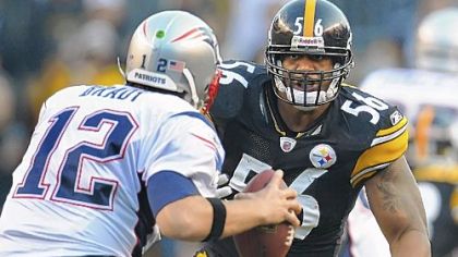 Steelers linebacker LaMarr Woodley sacks Patriots quarterback Tom Brady in the first half of a game at Heinz Field.
