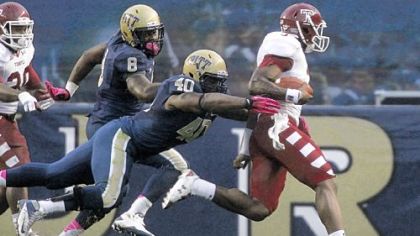 Pitt linebacker Dan Mason ackles Temple quarterback Clinton Granger Saturday at Heinz Field. Mason suffered a lacerated liver making a tackle late in the game and will miss the rest of the season.