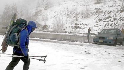 Backpacker Will Overman of Virginia Beach, Va., heads to his car Monday in the Great Smoky Mountains National Park, near Gatlinburg, Tenn.  About 50 backpackers took shelter in the park during Sunday night's snowfall.