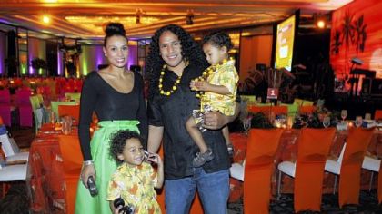 Troy Polamalu and his wife Theodora, with kids Paisios, and Troy holding Ephraim.