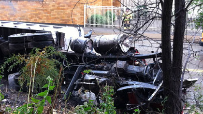 A tractor trailer overturned this morning near the intersection of Brady Street and Second Avenue. It struck four vehicles, killing one person and injuring two others.