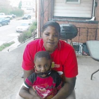 Conekia Finney in front of her mother's home with her son, Hezekiah, earlier this year.