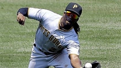 Pirates center fielder Andrew McCutchen dives and catches a ball in St. Louis in a season in which his defense was rewarded with his first Gold Glove.