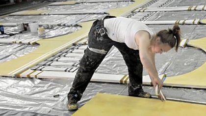 Adrienne Fischer, a scenic painter for the Pittsburgh Opera, works on the set for the upcoming production of Don Giovanni.