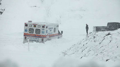 An ambulance was stuck in over a foot of snow off of Highway 33 West, near Belington, West Virginia, today.