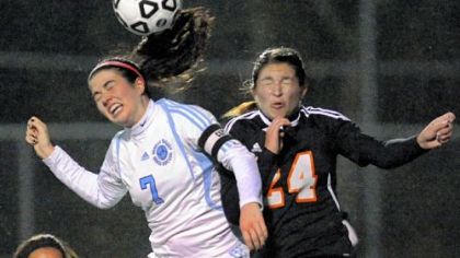 Seneca Valley's Misha Demchuk, left, heads the ball away from Bethel Park's Tori Bowler.
