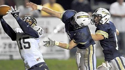 Franklin Regional's Charan Singh pulls in a pass for a touchdown as Knoch's Ben Tackett and Dakota Bruggeman defend during a game played Oct. 4.