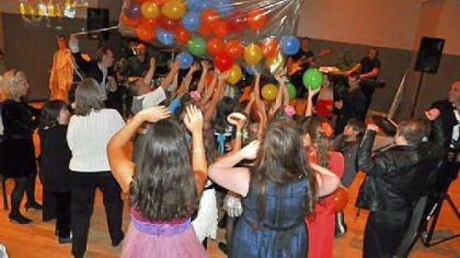 A group of special actors at a balloon drop during a program by the Center for Theater Arts in Mt. Lebanon. The center offers weekly free musical theater classes for special needs children and adults. Goals are for students to enjoy the singing, dancing and acting, and to develop communication skills and self-confidence.