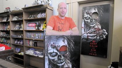 Chuck Cramer, co-owner of House of the Dead at Main and Butler streets in Lawrenceville, shows off his little shop of horrors.