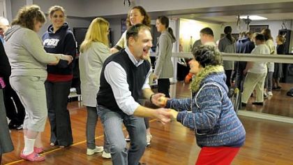 Chris Roth, owner-director of Steel City Ballroom, dances with Paula Karafa during a session sponsored by Yes, You Can Dance! at the Steel City Ballroom in Mt. Lebanon. The class provides dance opportunities for youths and young adults with special needs.