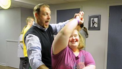 Chris Roth, owner-director of Steel City Ballroom, spins student Maria Fenlock during a dance in the Yes, You Can Dance! class at the Mt. Lebanon ballroom.