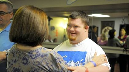 Brennan Reich of Peters shares a dance with partner-mentor Janice Seidenfeld.