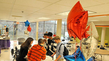 Students mark their ballots for the mock election in Upper St. Clair's cafeteria.