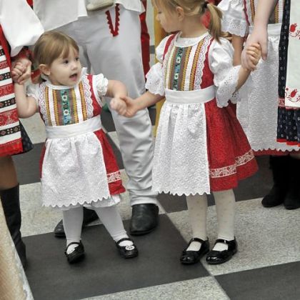 Lizzie Lipchick, 2, left, and Marissa Ann Tilger, 4, appear with the rest of the Pittsburgh Area Slovak Folk Ensemble Thursday during an announcement about Light Up Night.