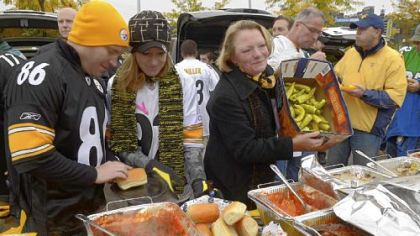Lynn Cauley of Park Place shows off some of the peppers she and her husband, Jim, use to create their tailgate spread at Heinz Field before the Steelers' game against the Eagles.