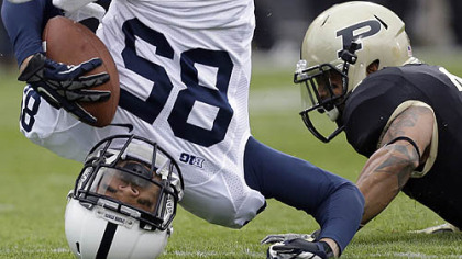 Penn State's Brandon Moseby-Felder lands on his head after making a catch and getting tackled by Purdue cornerback Ricardo Allen during the first half.