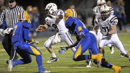 Knoch's Benjamin Tackett dodges West Mifflin defenders in the first quarter Friday at West Mifflin High School