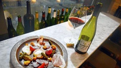 The salumi plate at Bar Marco in the Strip District features lomo, Spanish goat chorizo, lardo, chicken rillettes, pickles, mustards and baguettes from La Gourmandine in Lawrenceville.