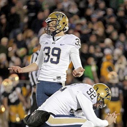 Kicker Kevin Harper, foreground, and holder Matt Yoklic react after Harper missed what would have been the-winning field goal in the second overtime Saturday in Notre Dame, Ind.