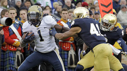 Pitt running back Ray Graham, left, breaks the tackle of Notre Dame safety Matthias Farley to score a touchdown during the first half.