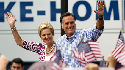 Mitt Romney waves as he arrives with his wife Ann at a campaign rally Oct. 7 in Port St. Lucie, Fla.