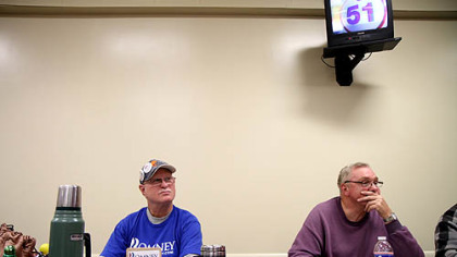 Chuck Griffiths, of Zanesville, Ohio, shows his support for Mitt Romney while playing bingo at MASS Bingo hall in Zanesville.