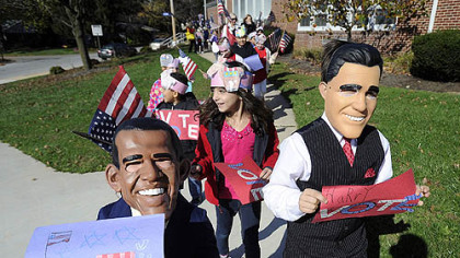 Second-graders Brayden Gentzyel, left, as President Obama and Harry Perkins, right, dressed as Mitt Romney, from Valley View Elementary School in the York Suburban School District in York, Pa., lead a parade of students around the school to encourage people to vote.