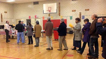 The first voters enter the poll at 7 a.m. at Linden Academy, Point Breeze.